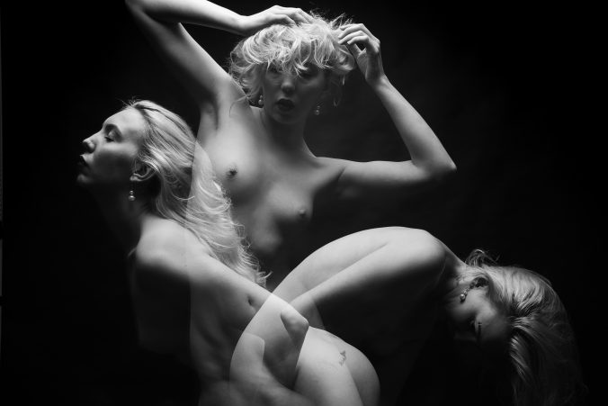 Multi exposure of a nude female model in black and white,